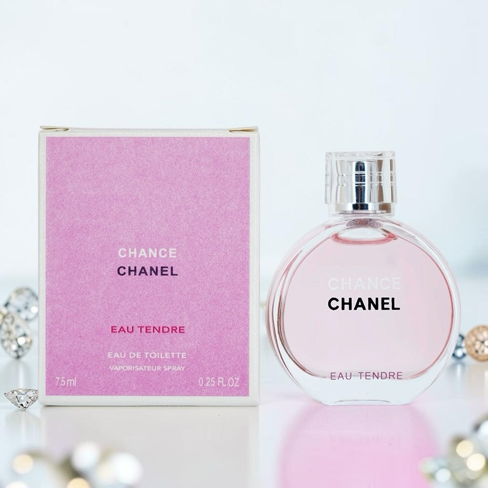 Nevora CHANEL Chance Eau Tendre Eau de Toilette perfume bottle and pink box on a white surface with decorative crystals.