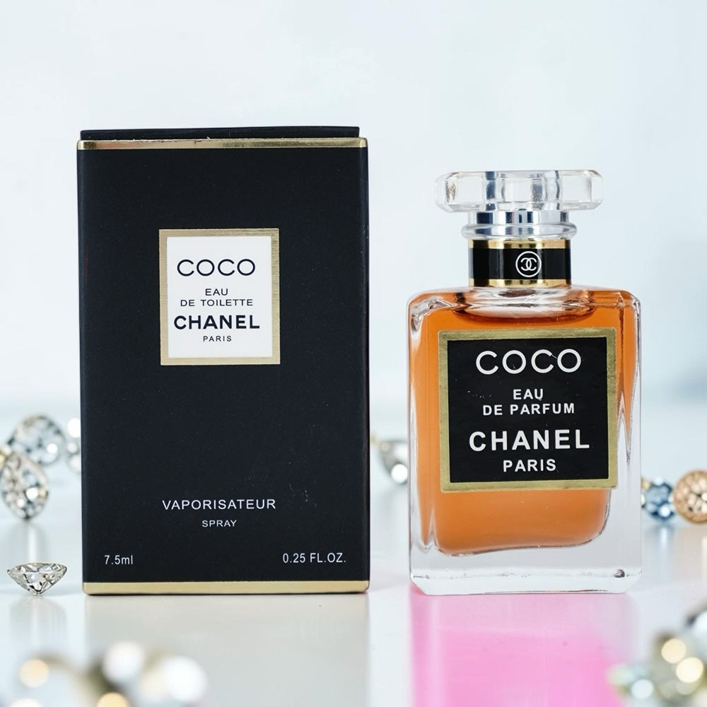 Nevora CHANEL Coco Eau de Parfum 7.5ml miniature glass spray bottle next to its black and gold branded box.