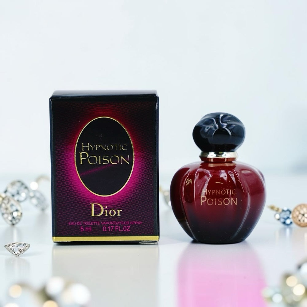 Nevora Dior Hypnotic Poison travel-size perfume bottle and box in deep red with black accents on a white surface.