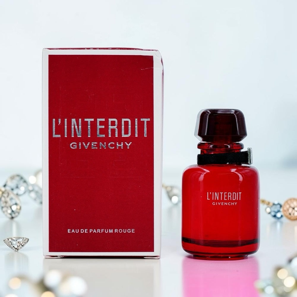 Nevora Givenchy L'Interdit Eau de Parfum Rouge bottle and red box on a white surface with decorative crystals