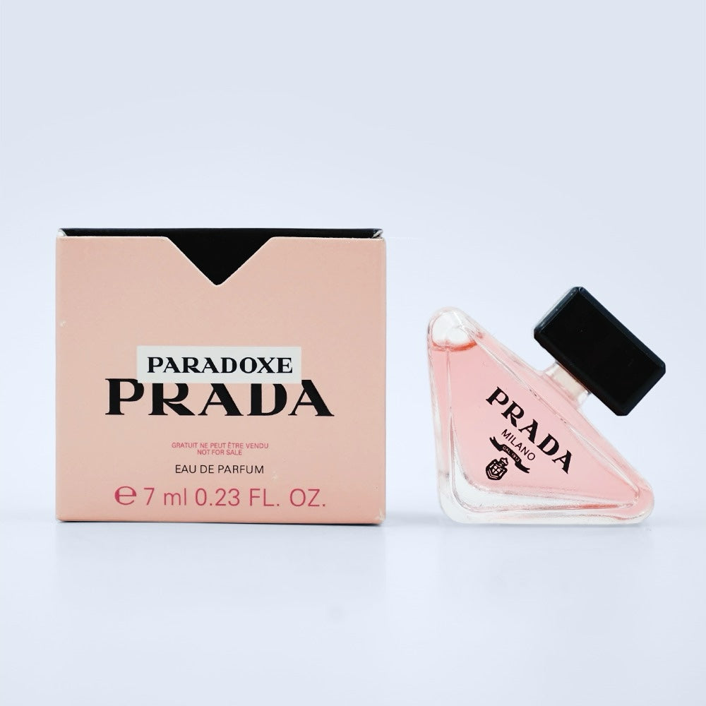 Nevora Prada Paradoxe Eau de Parfum 7ml miniature bottle with its light pink box featuring iconic triangular design.