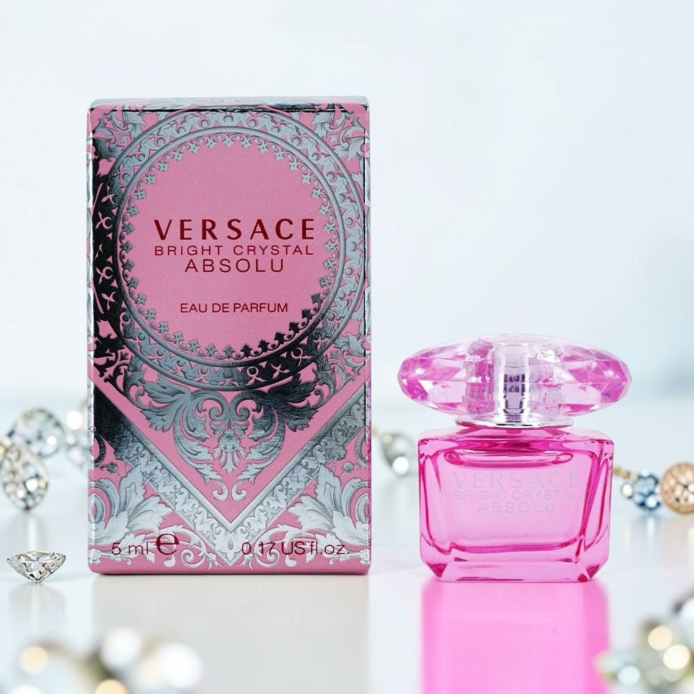 Nevora Versace Bright Crystal Absolu miniature perfume bottle and box with pink glass and crystal-inspired cap.
