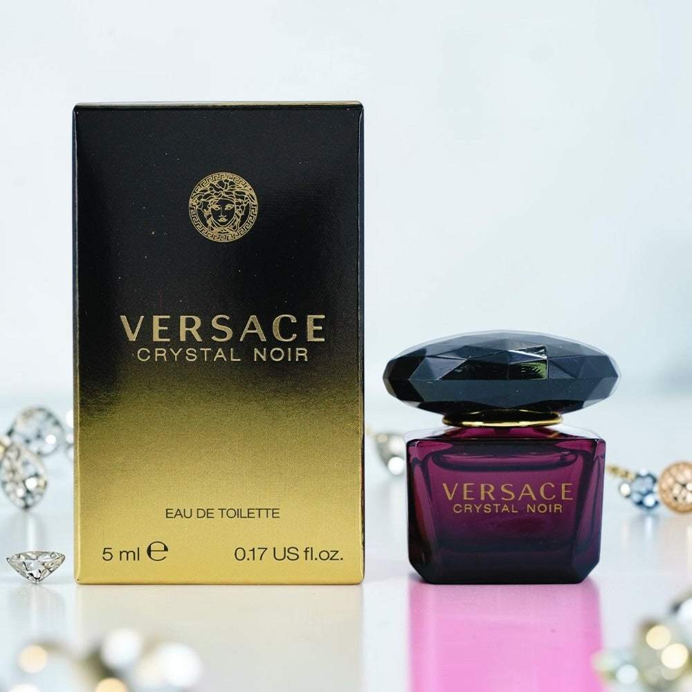 Nevora Versace Crystal Noir 5ml miniature eau de toilette bottle and black gold box with jewel-toned glass design